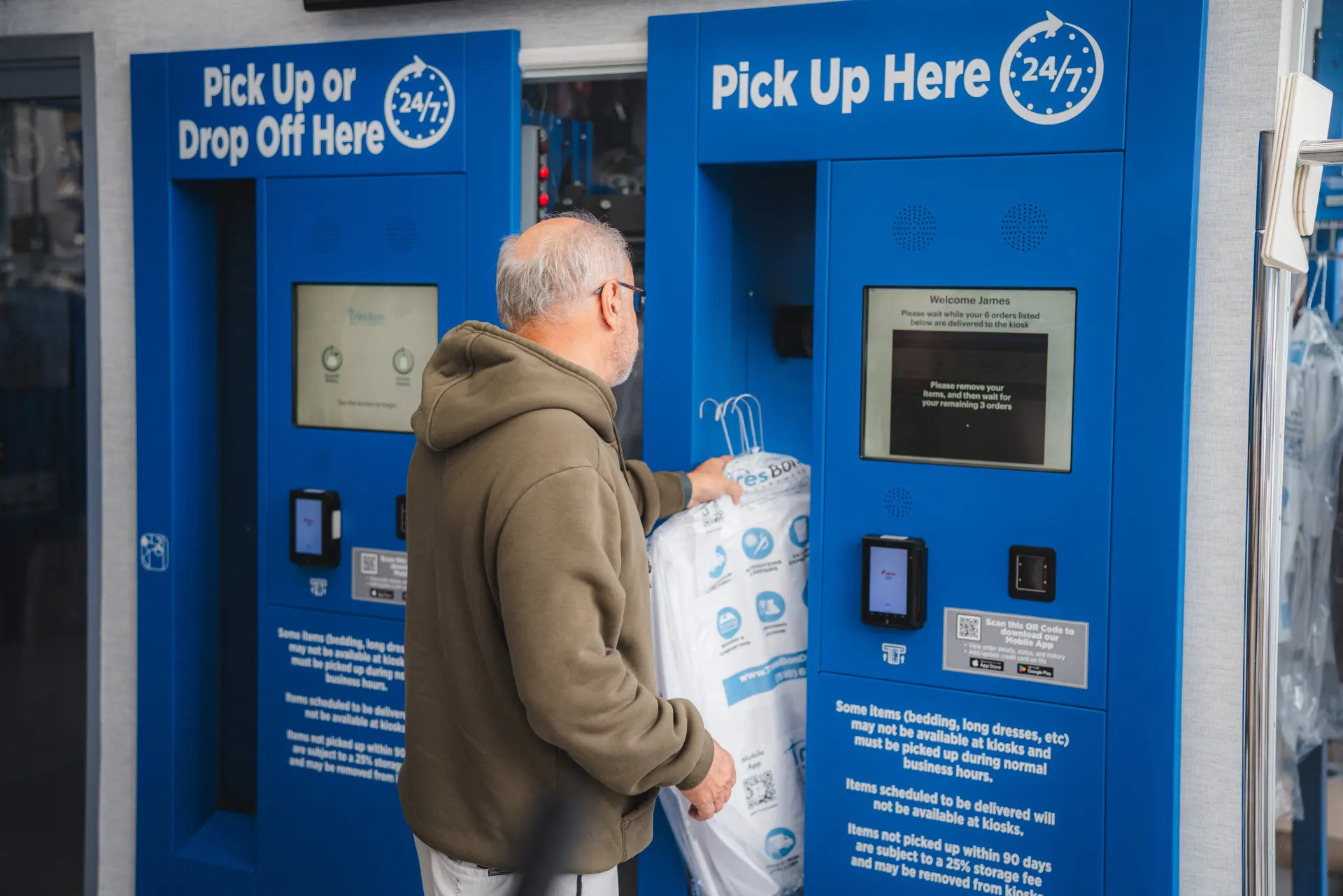 Customer dropping garments at a Tres Bon automated kiosk