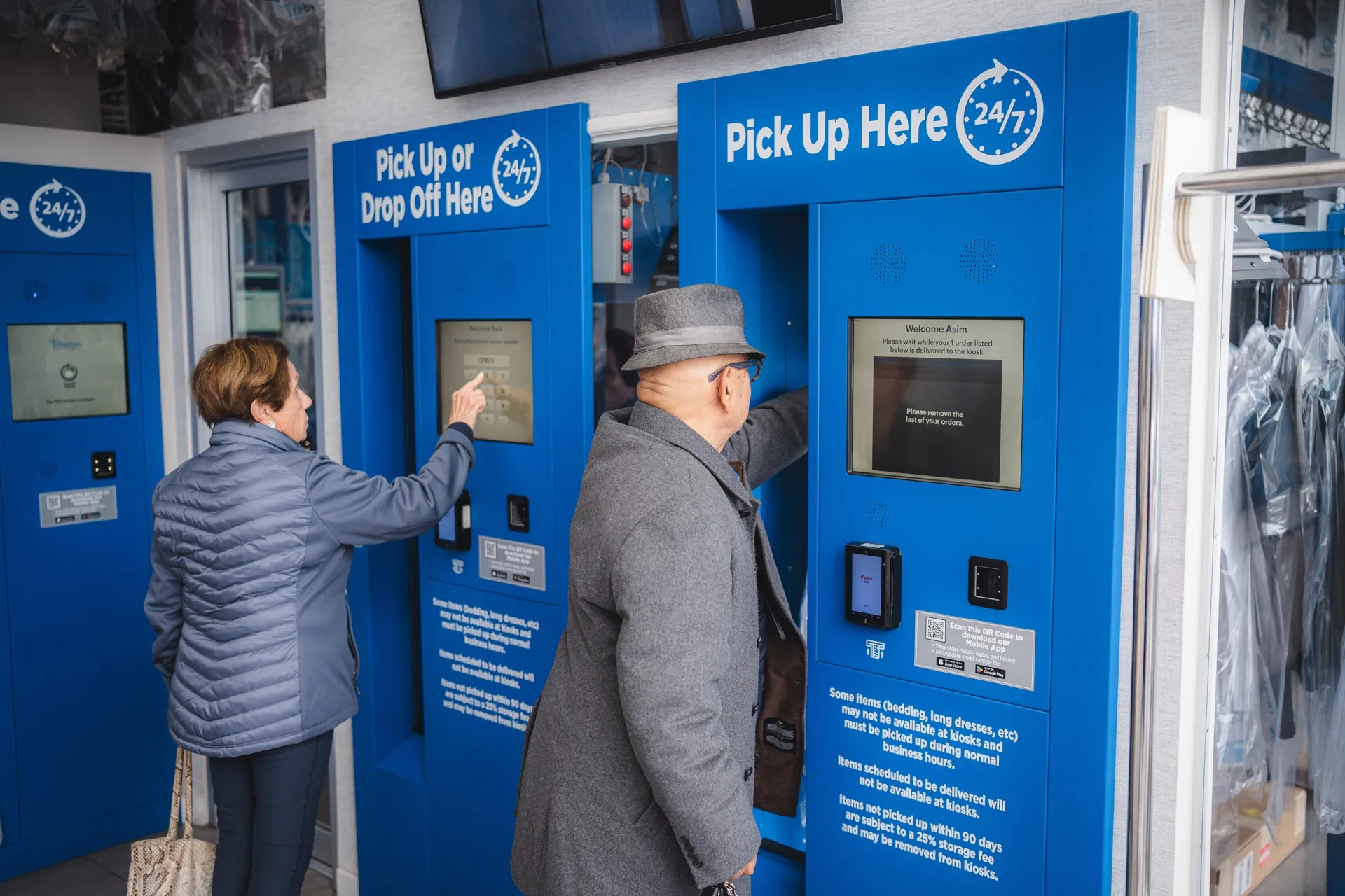 Customers using the Tres Bon 24/7 pick up kiosks